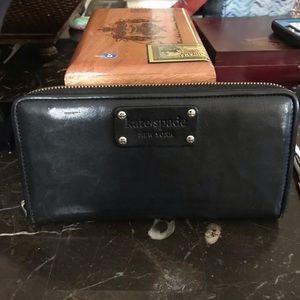 Black Kate Spade Wallet. Lots of rooms inside.